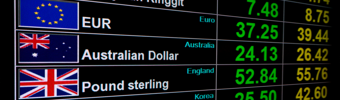 Exchange rate board showing EUR, AUD and GBP and various rates. 